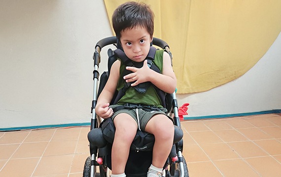 Four-year-old Enoch from Tuvalu is full of energy - and now, thanks to a specialised wheelchair buggy that truly fits him, he has a new sense of comfort and freedom.
